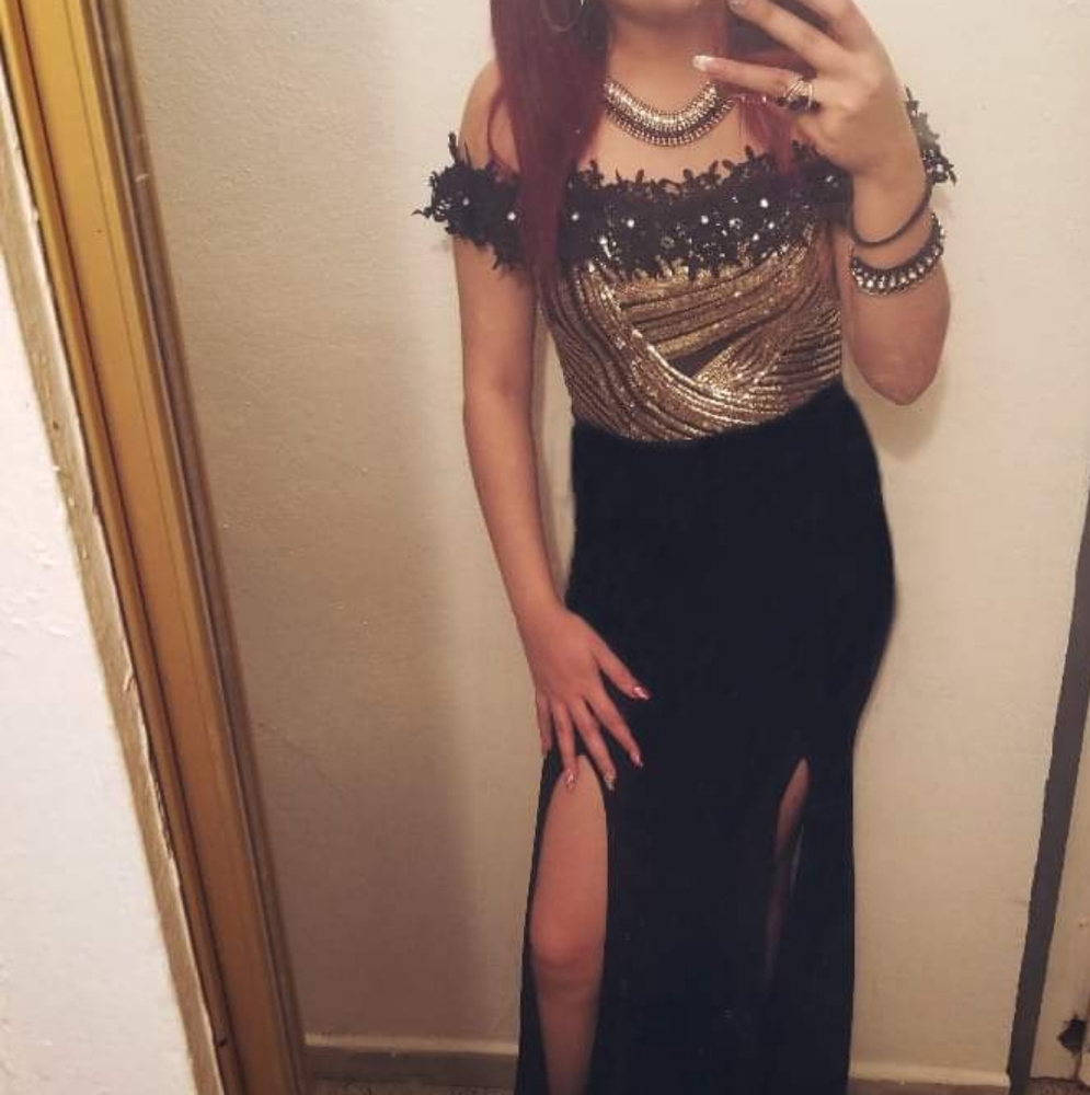 Long black and gold suit, with glitter.
